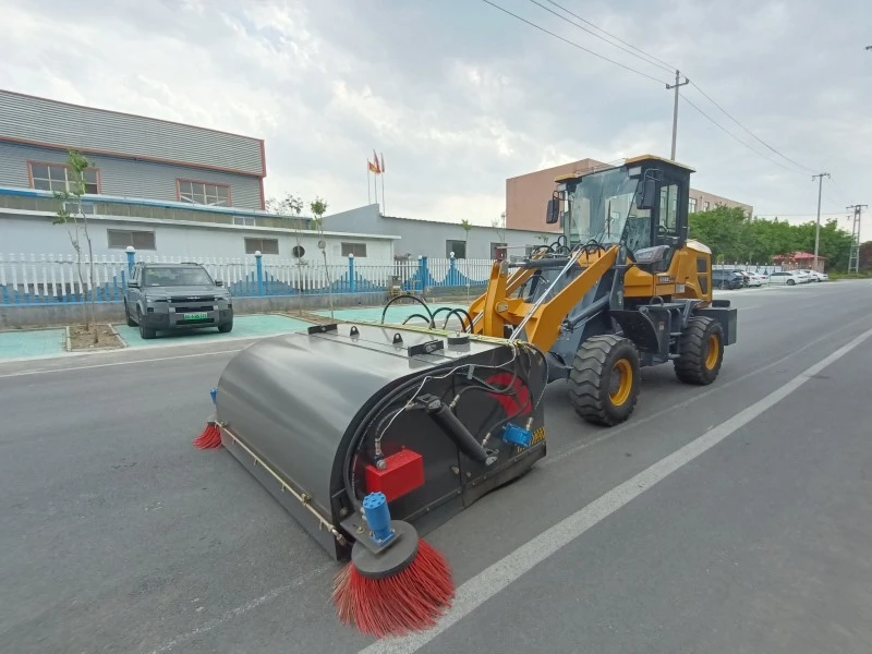Loader sweeper on construction site
