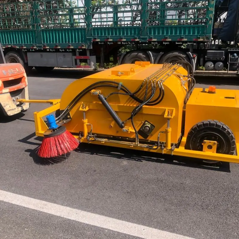 Towed trailer sweeper working